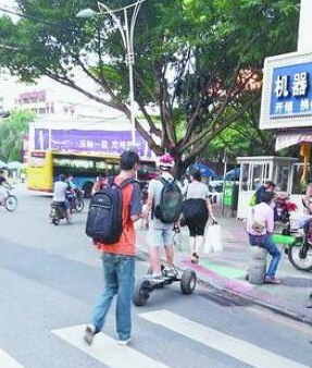“拉风”电动平衡车上路就违法 被发现将处罚——九房网